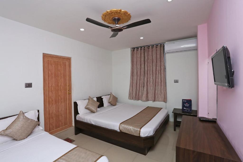 Katil atau katil-katil dalam bilik di Hotel O Aashray Guest House