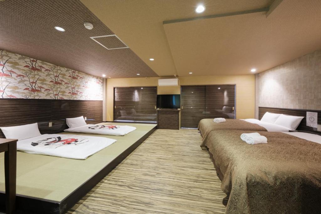 a hotel room with two beds and a television at Disney Style Hotel "J Hotel" - Vacation STAY 17216v in Chiba