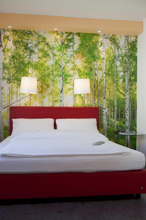 Postel nebo postele na pokoji v ubytování Hotel Erbprinzenhof