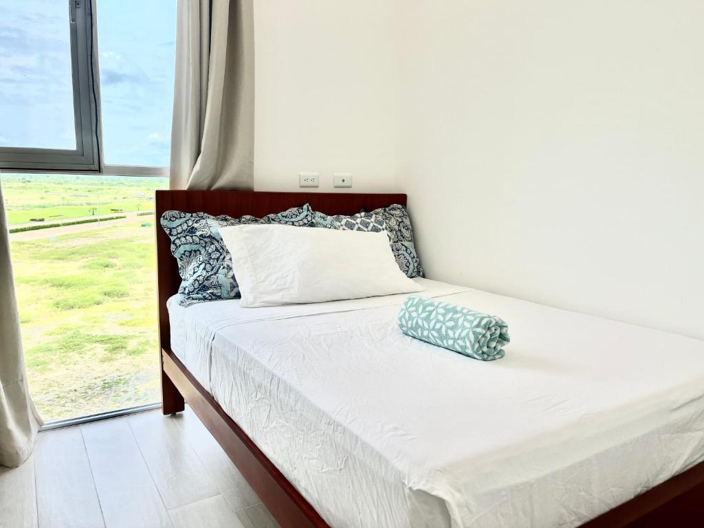 Ένα ή περισσότερα κρεβάτια σε δωμάτιο στο Departamento panorámico Bari 201 en Karibao