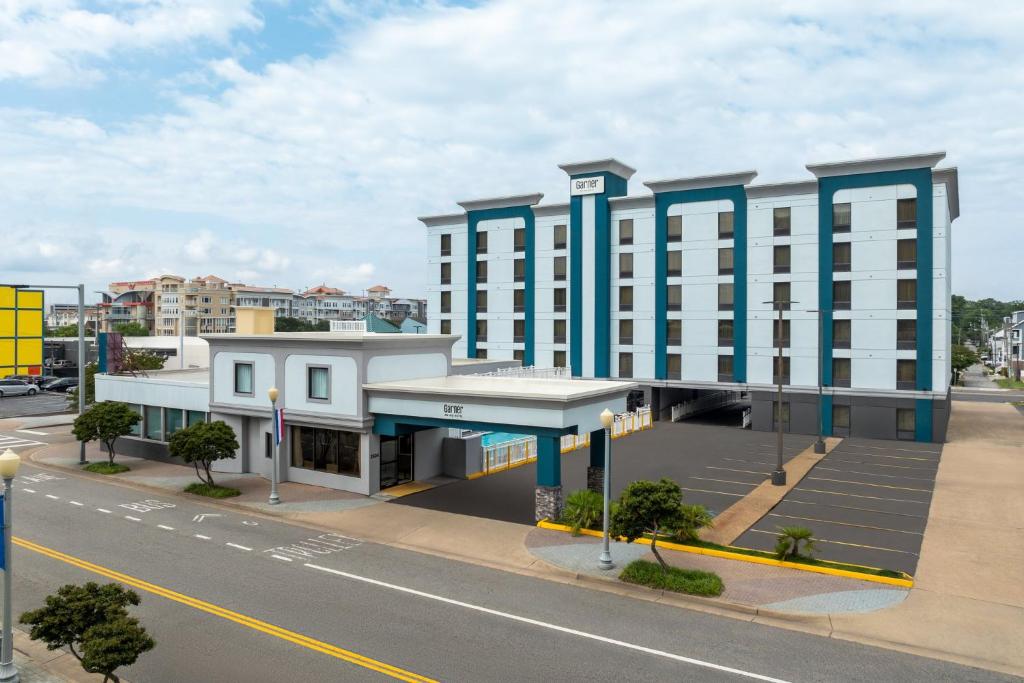 a rendering of a building on a city street at Garner Hotel Virginia Beach North by IHG in Virginia Beach