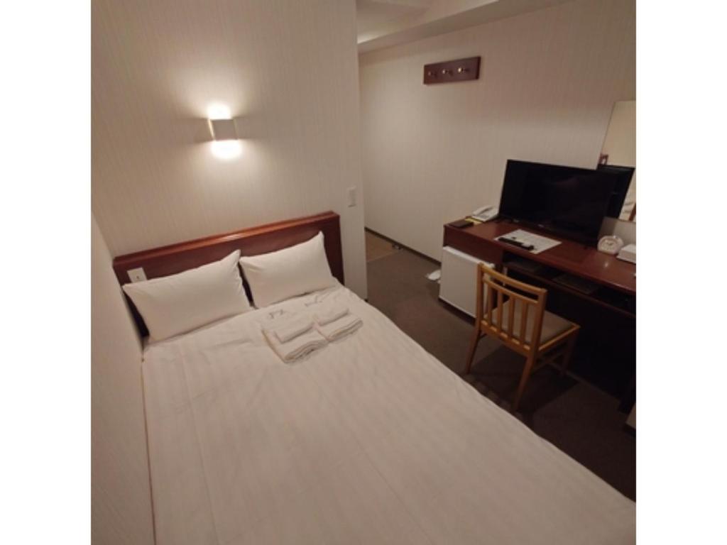 Ένα ή περισσότερα κρεβάτια σε δωμάτιο στο Smile Hotel Namba - Vacation STAY 68501v