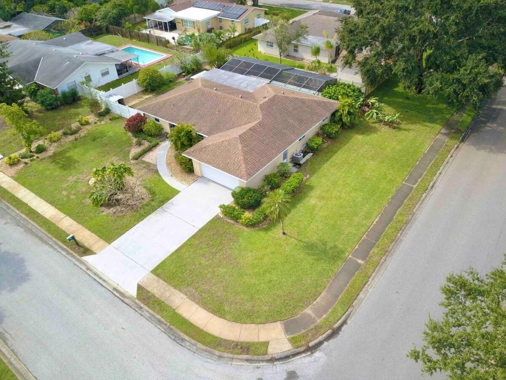 an aerial view of a house with a roof at Stylish Home near Anna Maria Island Beaches - Heated Pool - Oasis in Bradenton