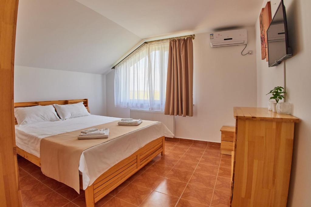 Ένα ή περισσότερα κρεβάτια σε δωμάτιο στο Casa Siaj