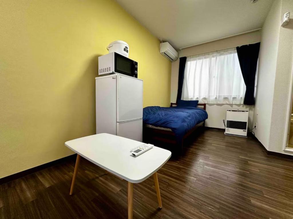 Ένα ή περισσότερα κρεβάτια σε δωμάτιο στο Sky Heights - Vacation STAY 19629