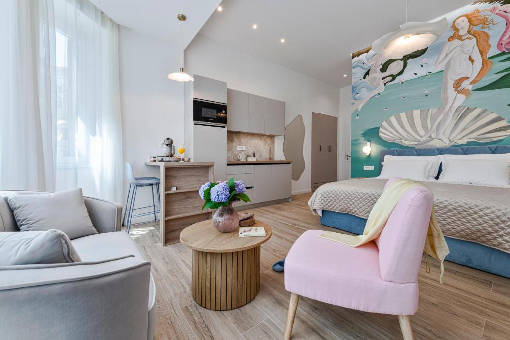 a bedroom with a king sized bed and a living room at Rebirth apartments in Dubrovnik