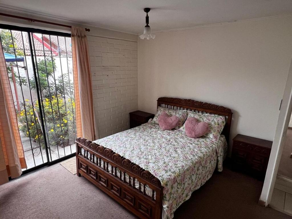 Postel nebo postele na pokoji v ubytování Casa Coquimbo Verano