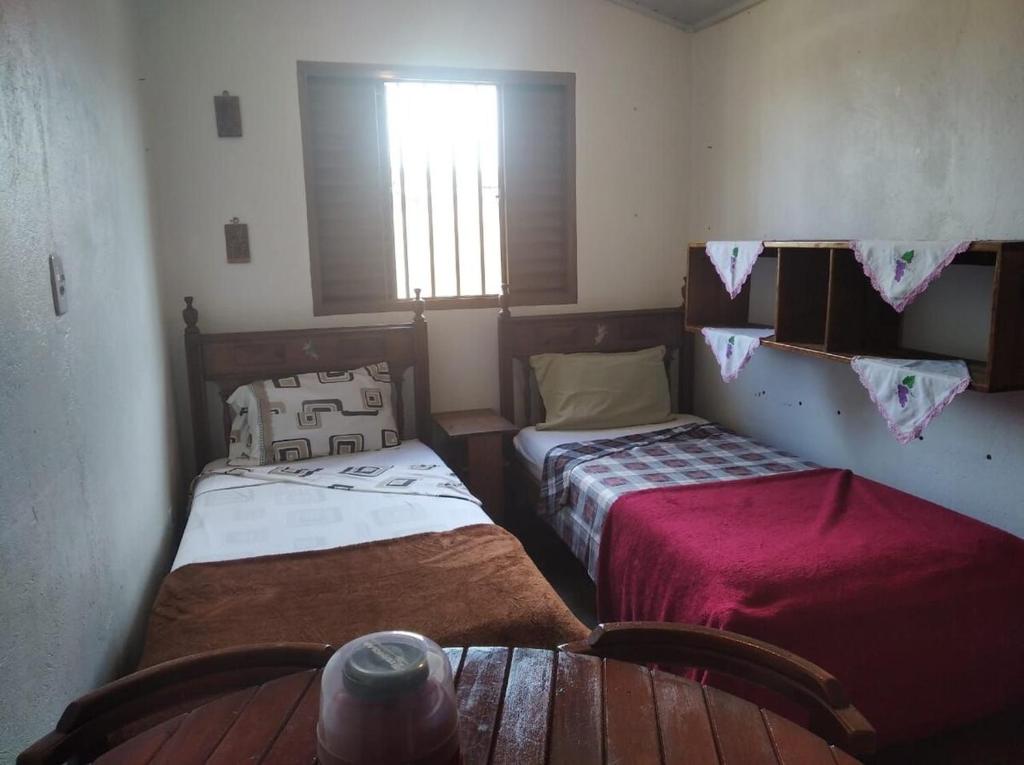 Postel nebo postele na pokoji v ubytování Recanto do Sabiá Residential