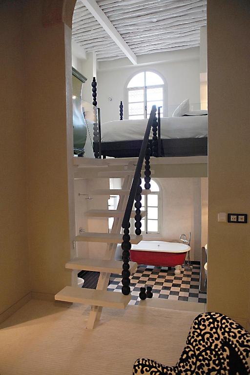 Postel nebo postele na pokoji v ubytování L'Alcazar