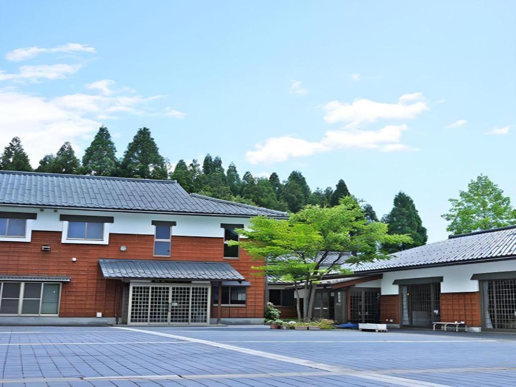 a building with solar panels on the side of it at Otaiko Hills in Fukui