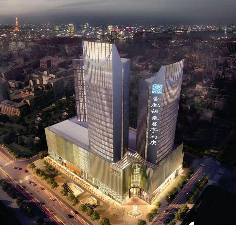 合肥市にあるSSAW Boutique Hotel Hefei Intime Centreの都会の高層ビルの上面