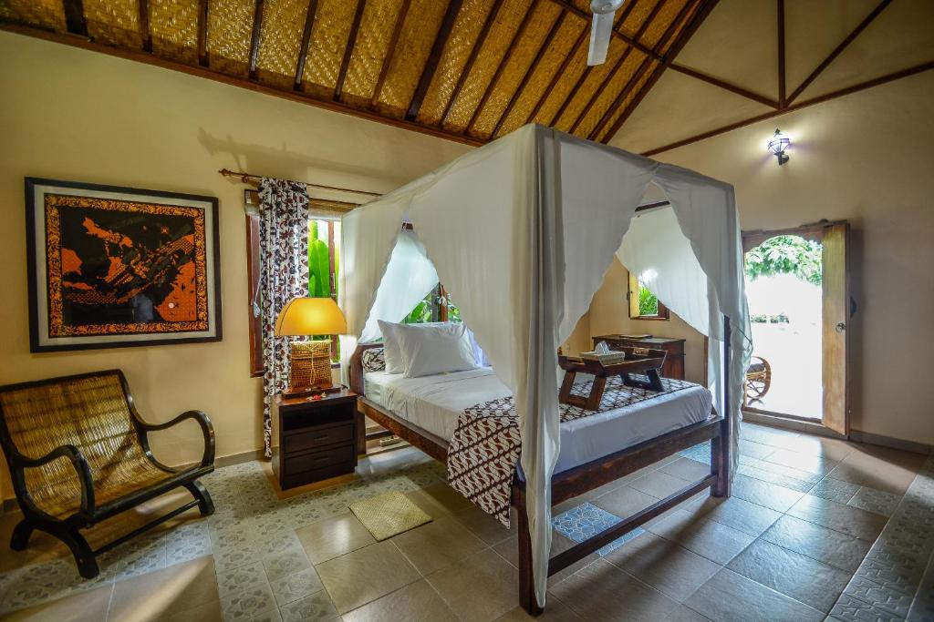Postel nebo postele na pokoji v ubytování Aashaya Jasri Resort