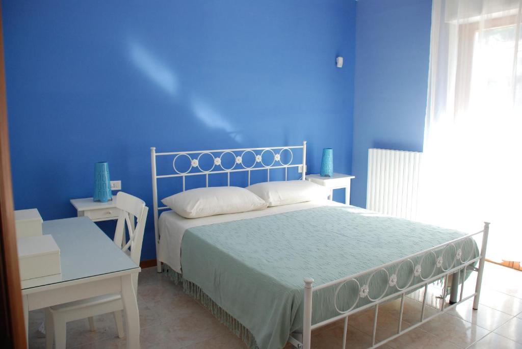 Postel nebo postele na pokoji v ubytování Cala Chiara B&B