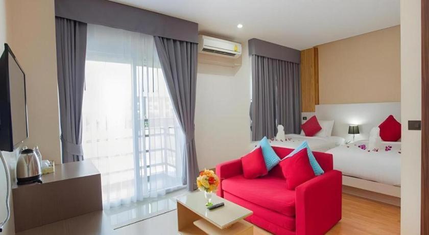 Postel nebo postele na pokoji v ubytování GT Residence Hotel