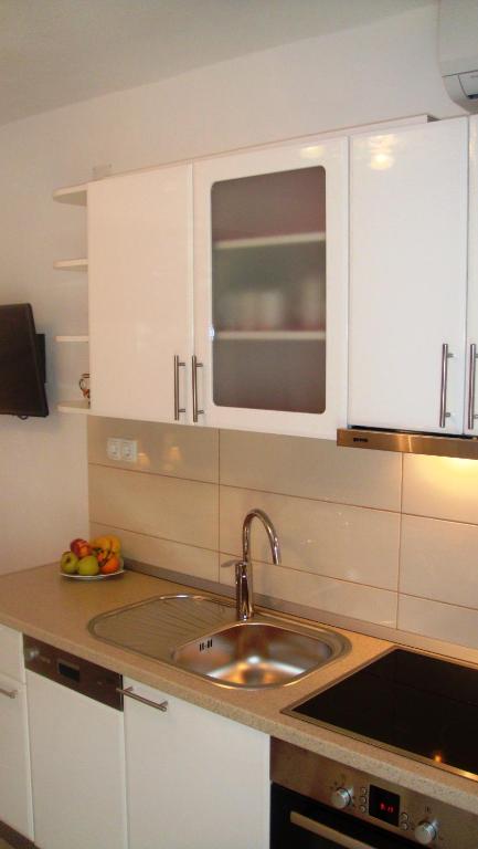 Kuchyň nebo kuchyňský kout v ubytování Apartments Topo