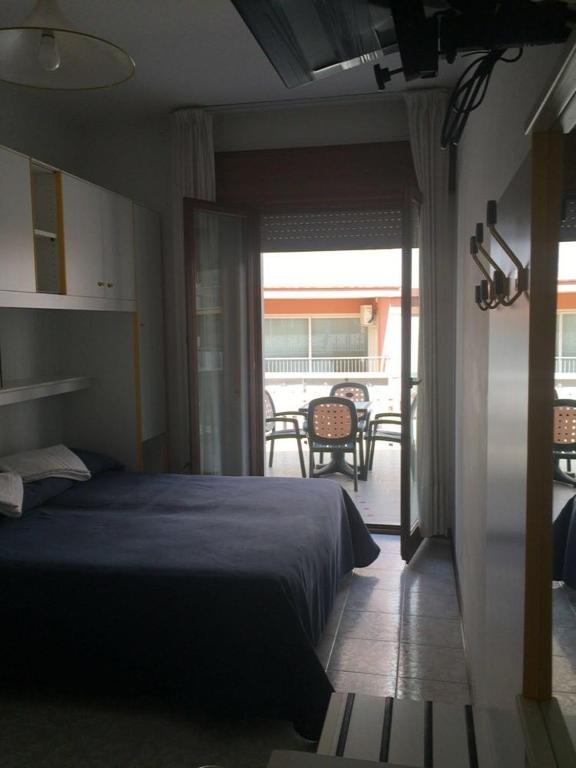 Postel nebo postele na pokoji v ubytování Hotel Malibran