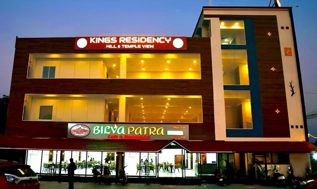 a building with a sign on the side of it at Kings Residency in Tiruvannāmalai