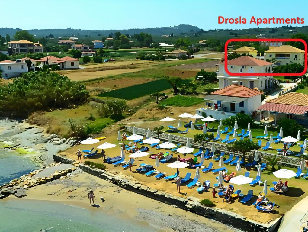 an aerial view of the resort and the beach at Drosia Apartments in Kypseli
