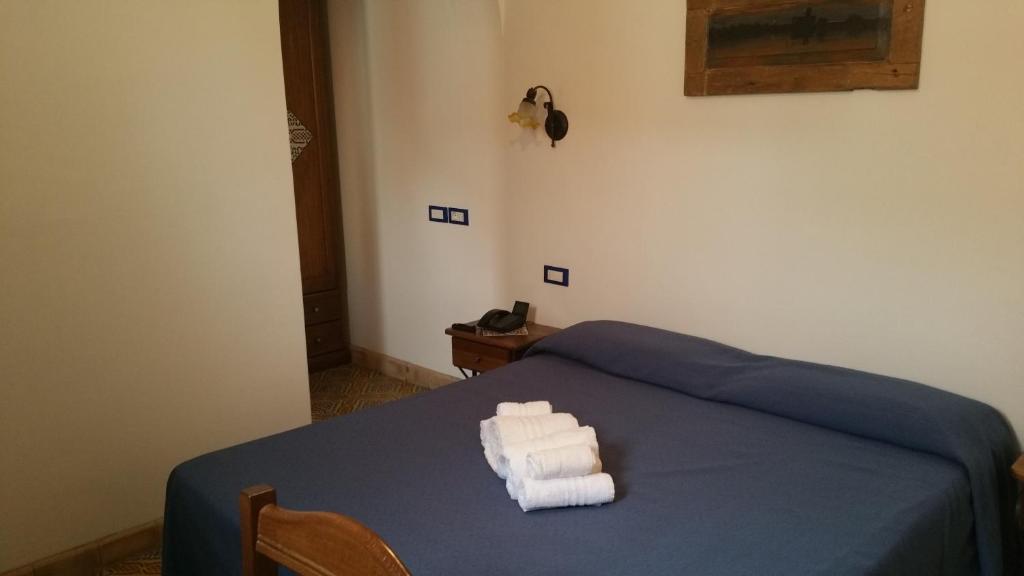 Postel nebo postele na pokoji v ubytování Hotel A Cannata