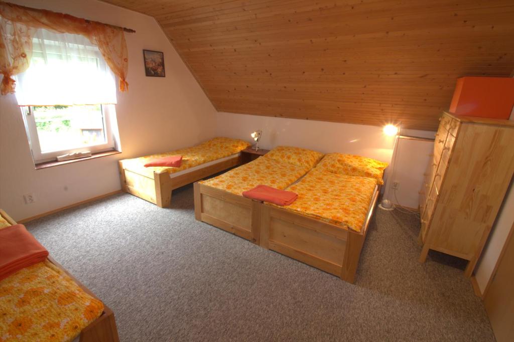 Postel nebo postele na pokoji v ubytování Orange House