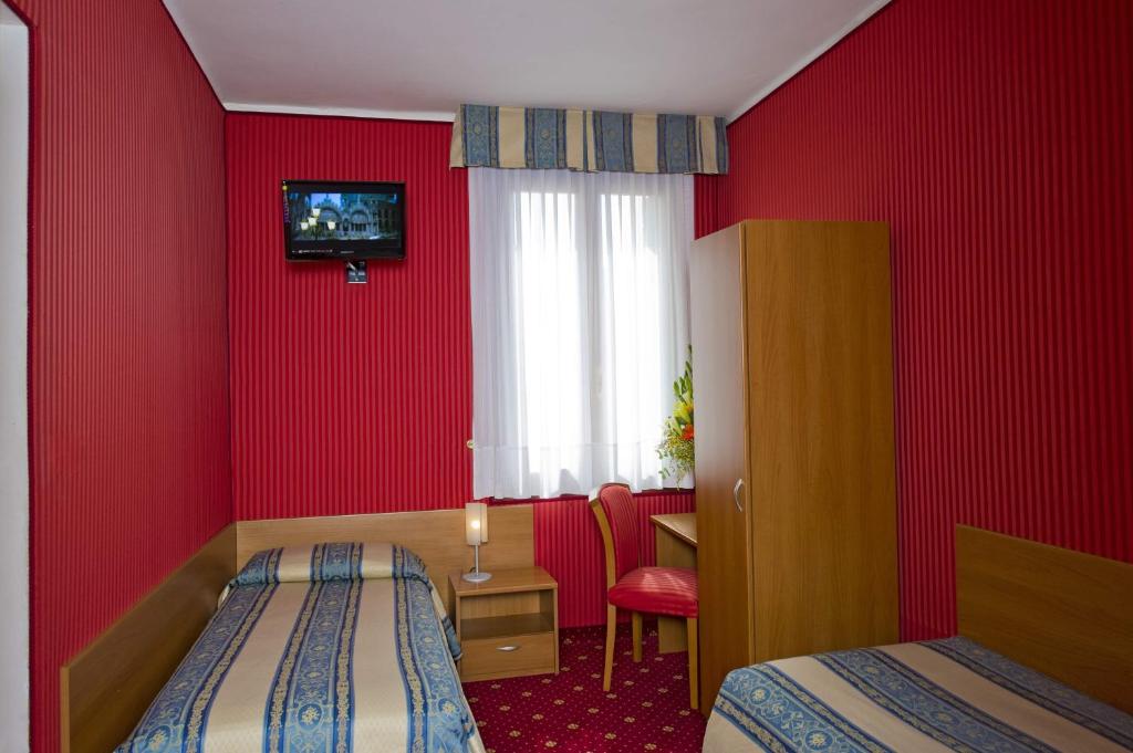 Postel nebo postele na pokoji v ubytování Hotel Nazionale