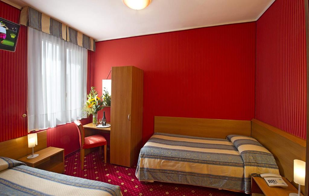 Postel nebo postele na pokoji v ubytování Hotel Nazionale