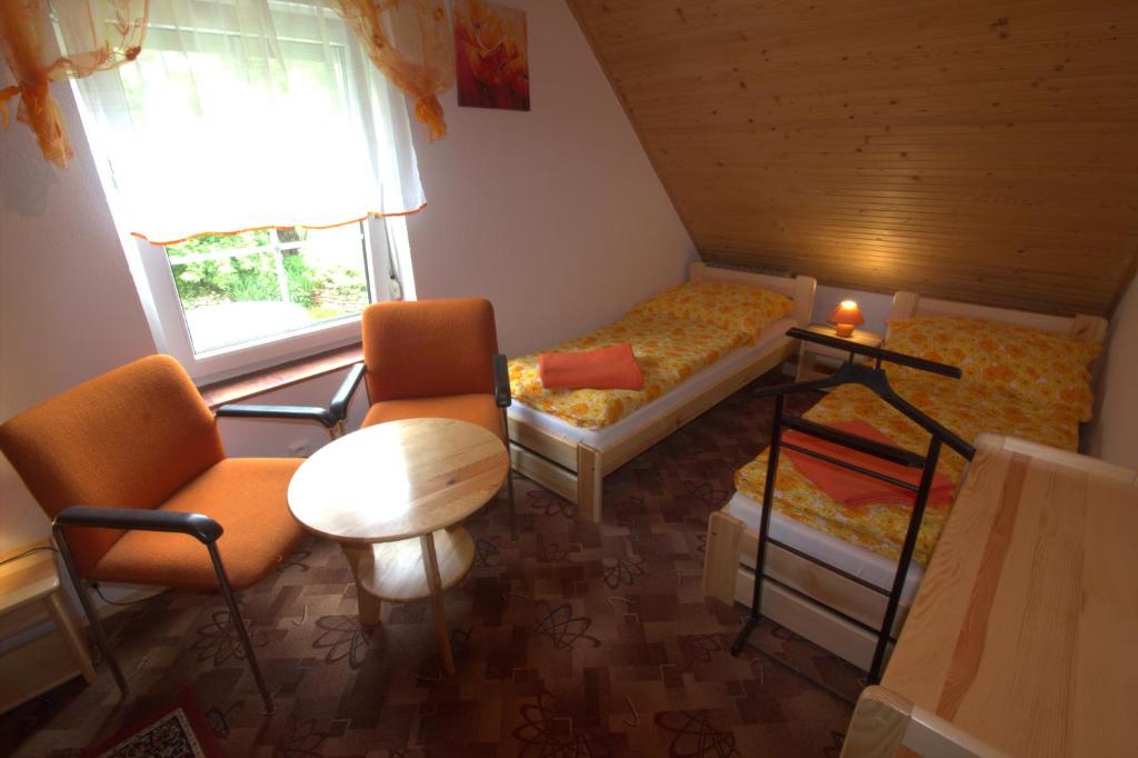 Postel nebo postele na pokoji v ubytování Orange House