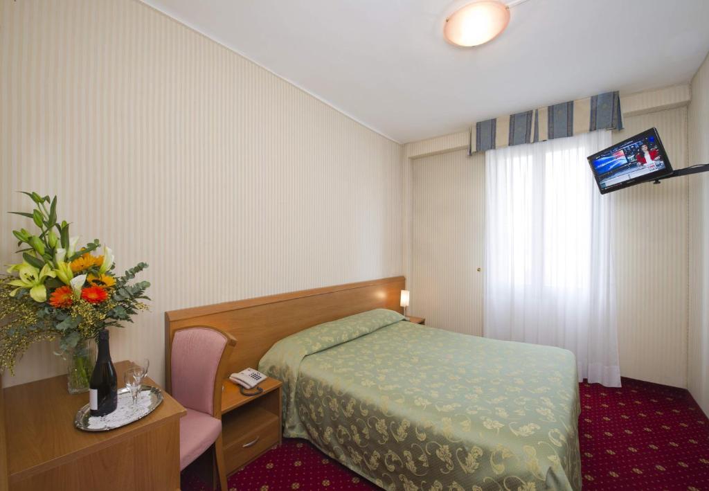 Postel nebo postele na pokoji v ubytování Hotel Nazionale