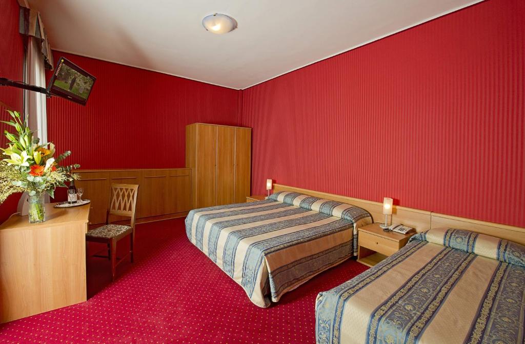 Postel nebo postele na pokoji v ubytování Hotel Nazionale