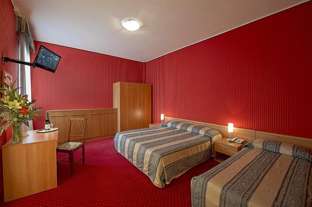 Postel nebo postele na pokoji v ubytování Hotel Nazionale