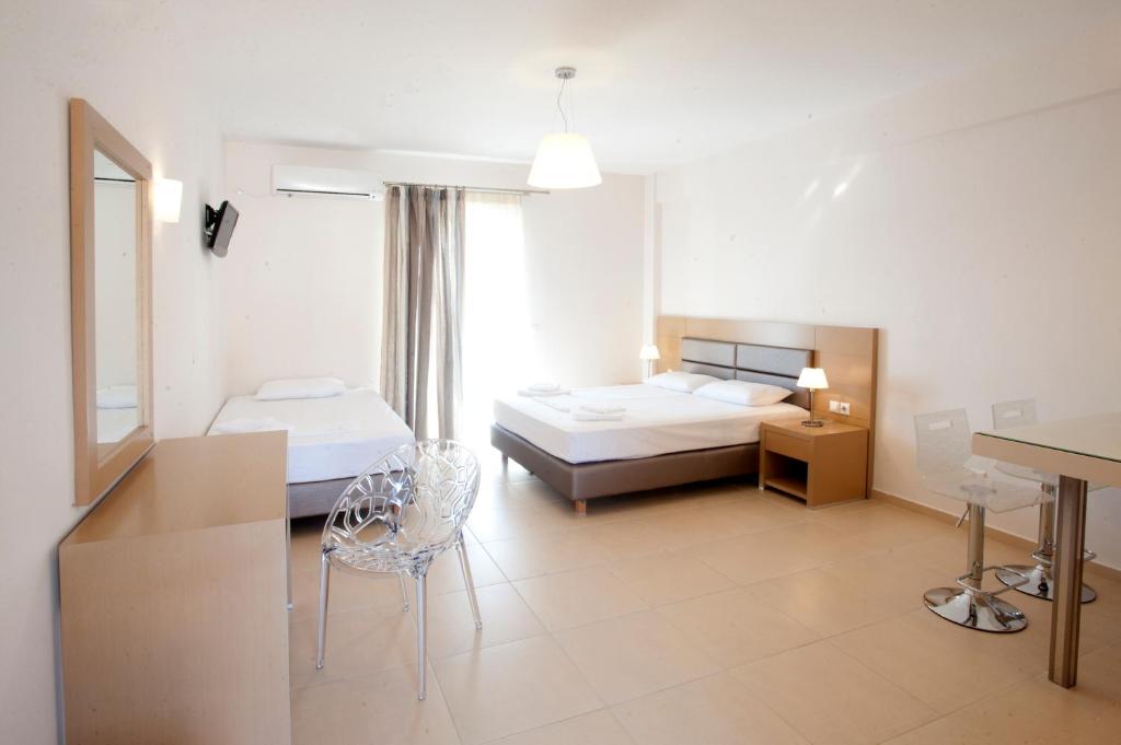 Postel nebo postele na pokoji v ubytování Georgio Seaside Hotel