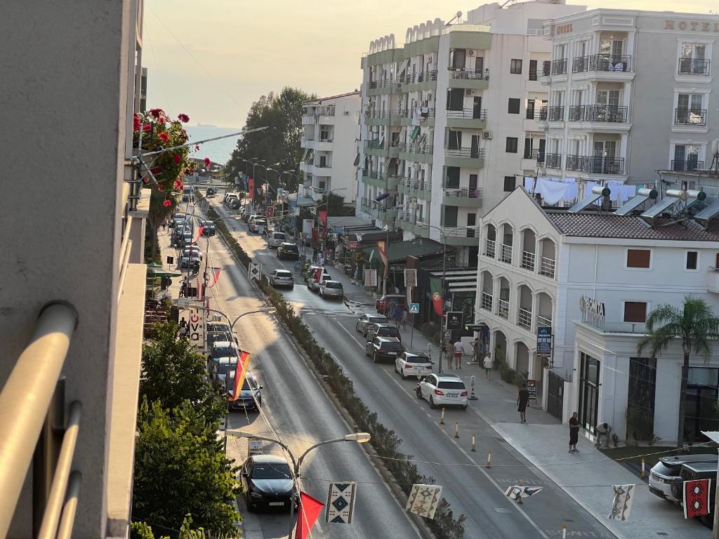 a view of a city street with cars and buildings at Iona Apartment Golem 2 in Polisi i Vogël