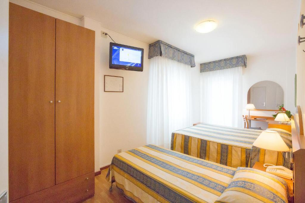 Postel nebo postele na pokoji v ubytování Hotel Adria sul Mare