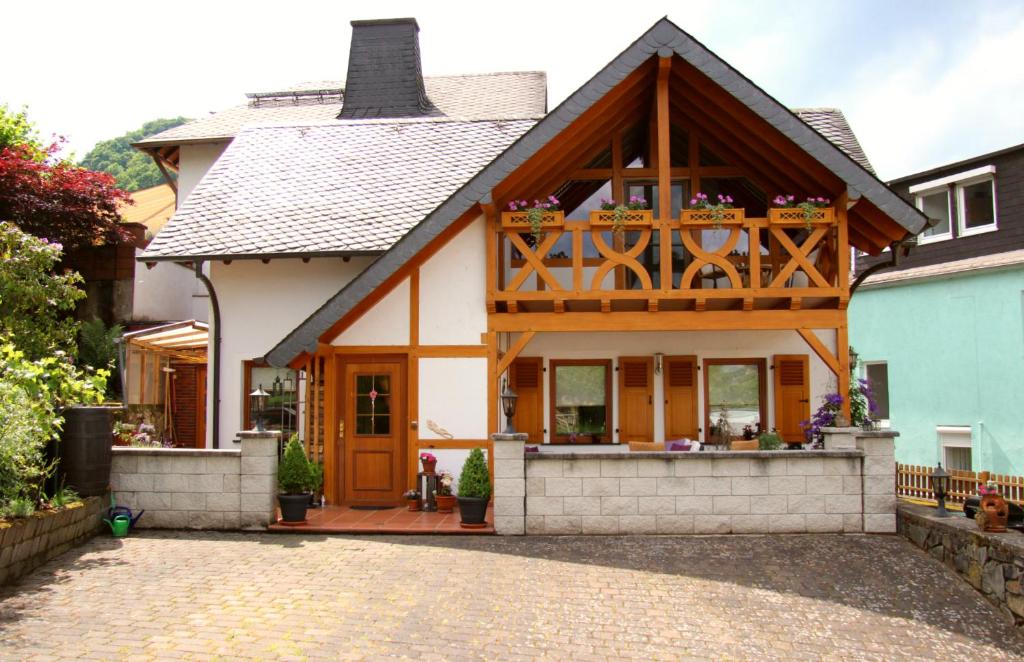 a house with a balcony on top of it at Haus Winkelchen in Cochem