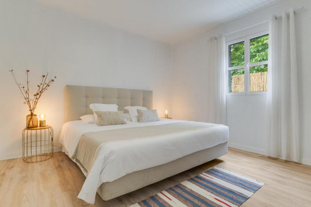 En eller flere senge i et værelse på Casa Teixeira by Holiday Rental Madeira