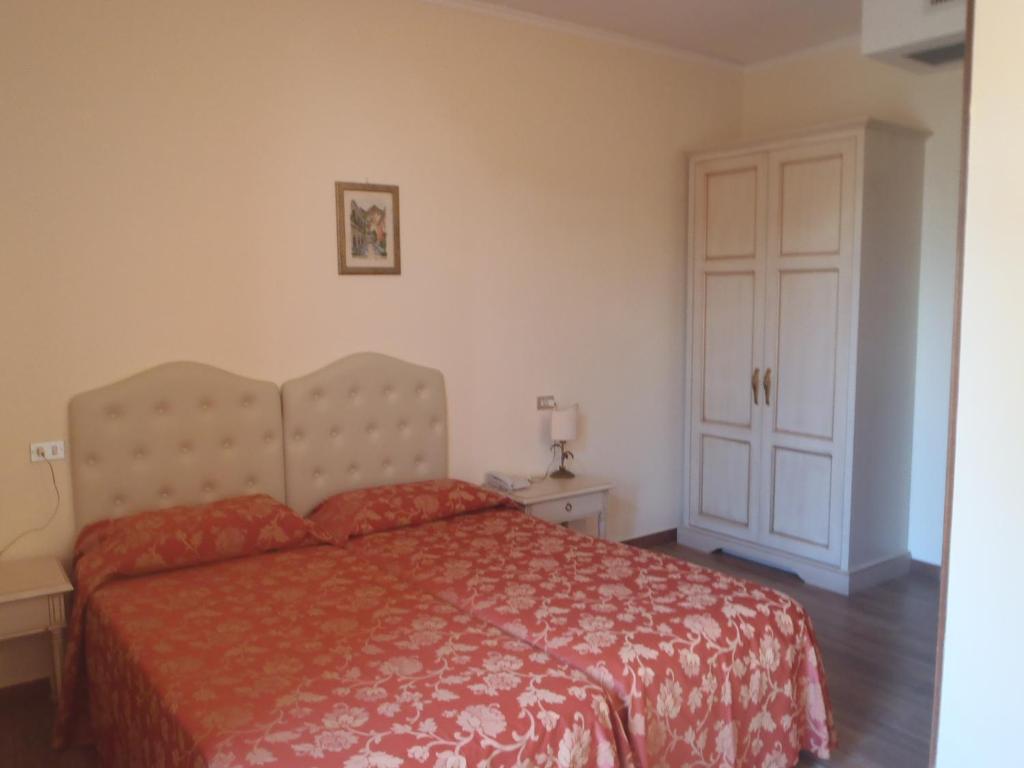 Postel nebo postele na pokoji v ubytování Hotel Ipanema
