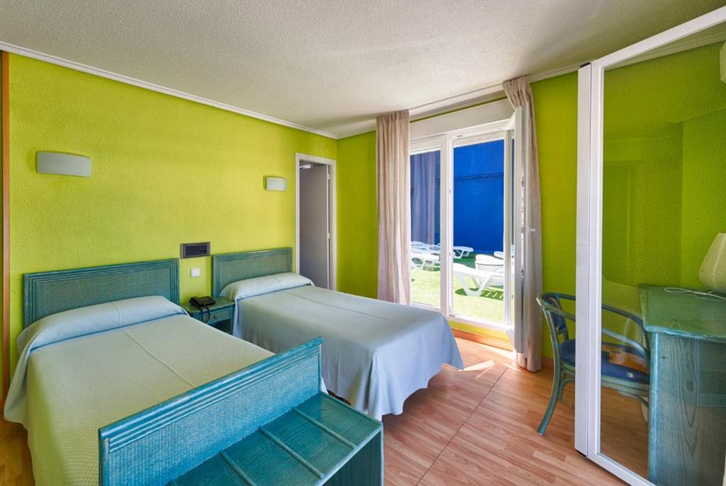 Postel nebo postele na pokoji v ubytování Hotel Marina