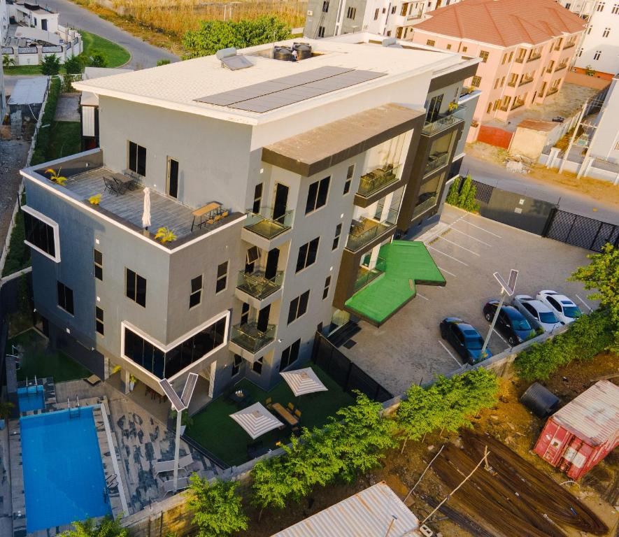 an overhead view of a large white building at The Cove Apartments in Abuja
