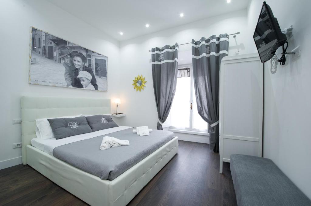 a bedroom with a bed and a television in it at Nido all'Aventino in Rome