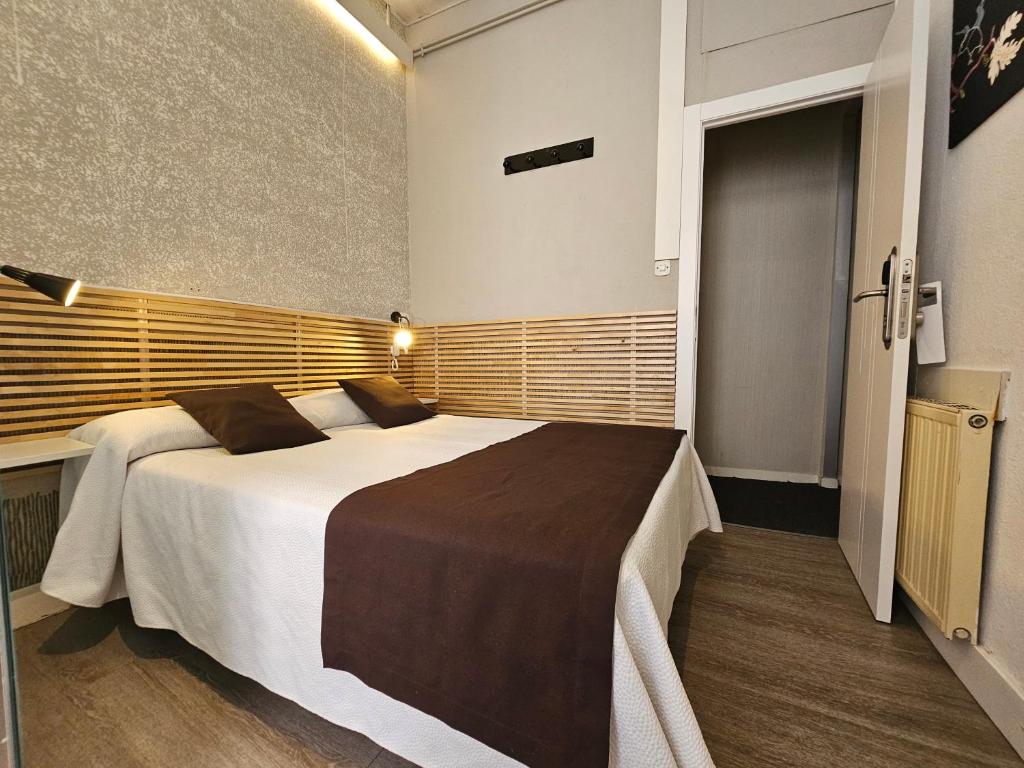 Postel nebo postele na pokoji v ubytování Hotel Palermo