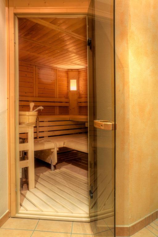 Postel nebo postele na pokoji v ubytování Garni Apparthotel St Valentin