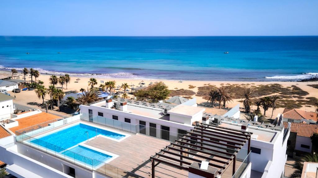 a view of the beach from the balcony of a hotel at Apartamento Praia Santa Maria in Santa Maria