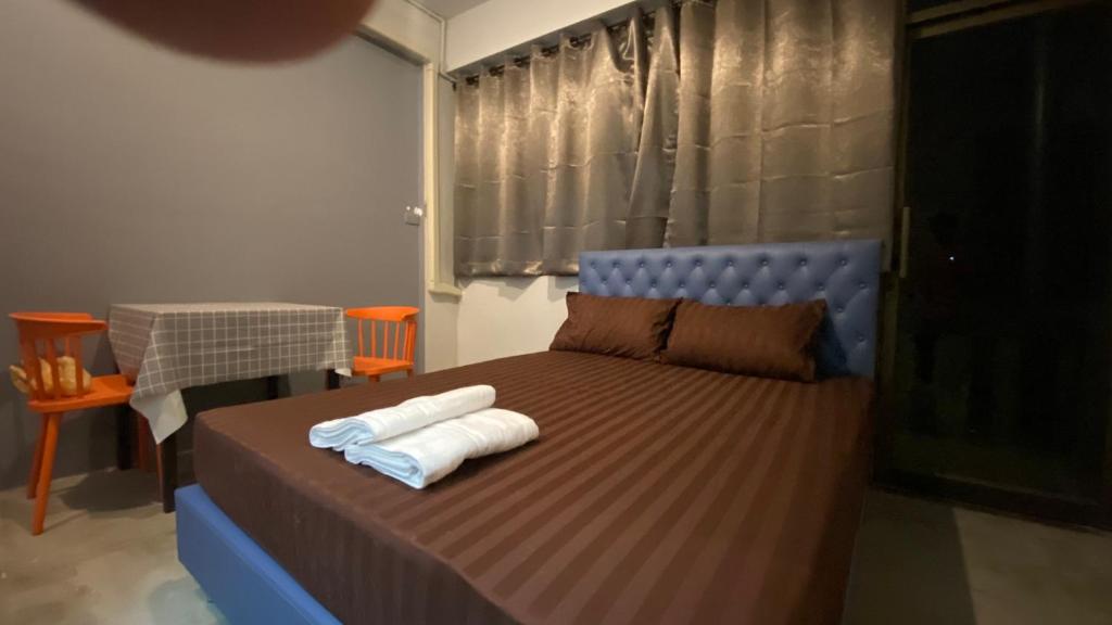 Postel nebo postele na pokoji v ubytování Capricorn hostel Yaowarat