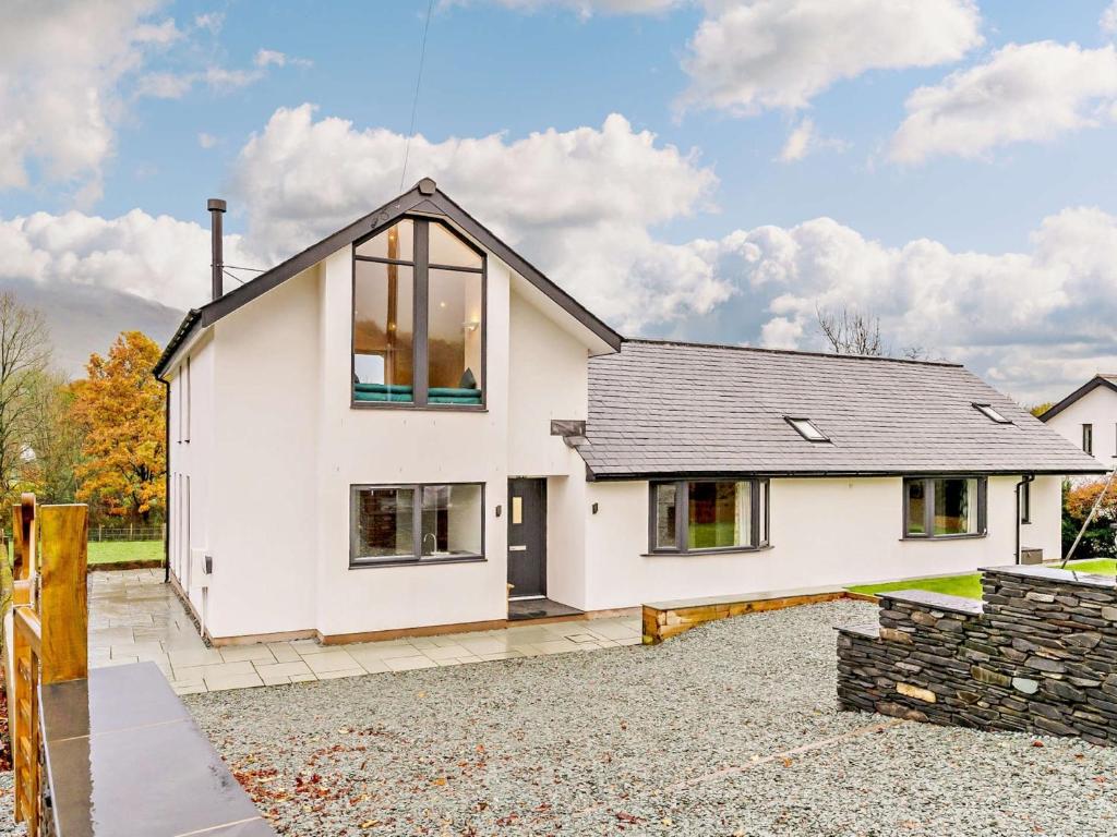 a white house with a black roof at 3 Bed in Threlkeld 93589 in Threlkeld