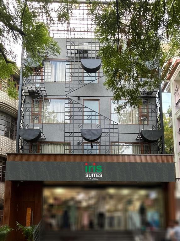 a building with chairs on top of a building at Iris Suites Kalkaji in New Delhi