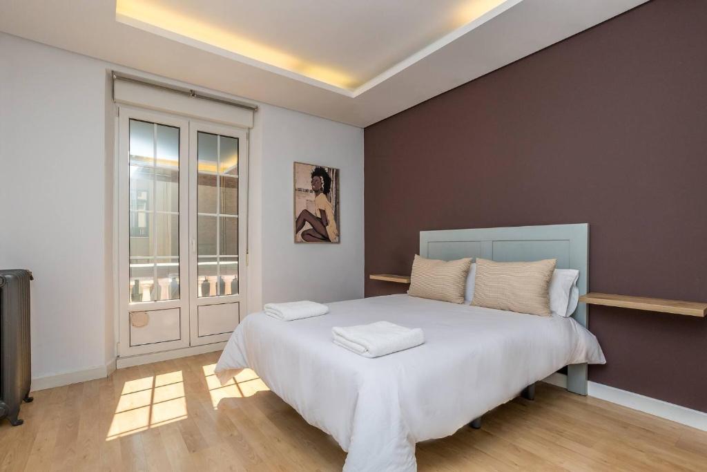 Postel nebo postele na pokoji v ubytování BaruHaus Santo Domingo GRUPOS