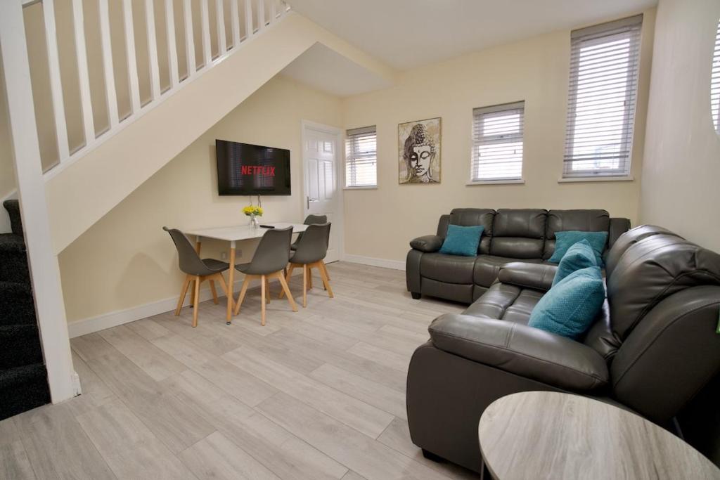 a living room with a couch and a table at Warwick Row Apartments Coventry City Centre - Flat 3 in Coventry