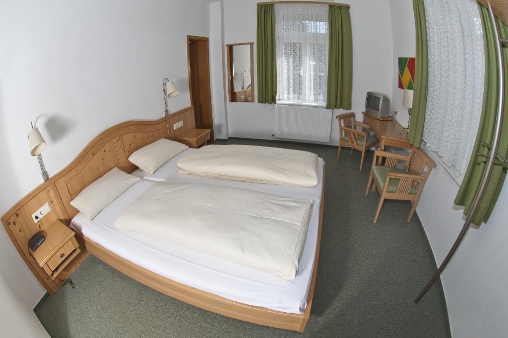 Postel nebo postele na pokoji v ubytování Action Forest Hotel - Kletterwald - Lasertag - nähe Badeparadies