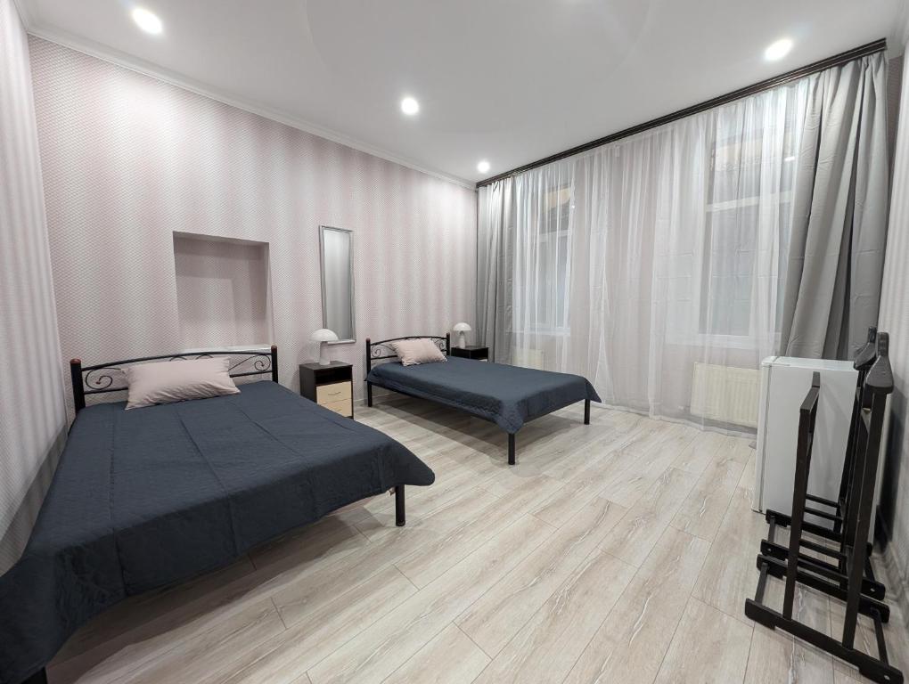 Postel nebo postele na pokoji v ubytování Серце Міста - The City Heart