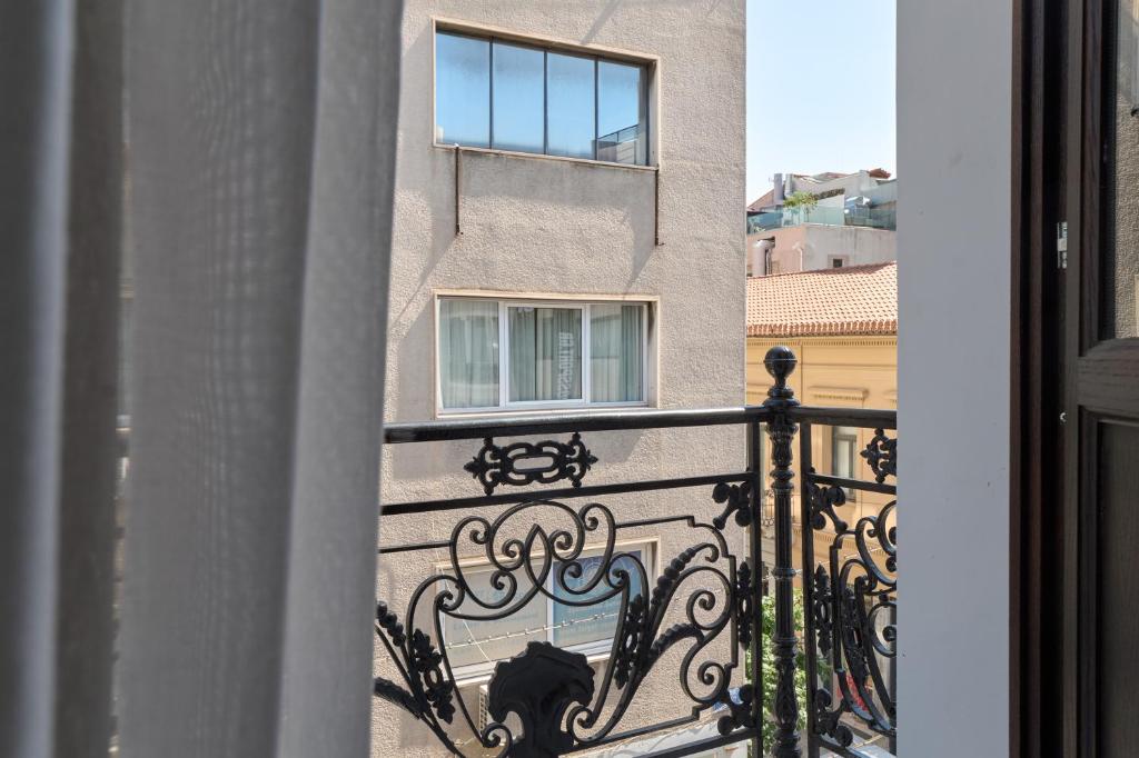 a view of a building from a balcony at Athens Icon Collection in Athens